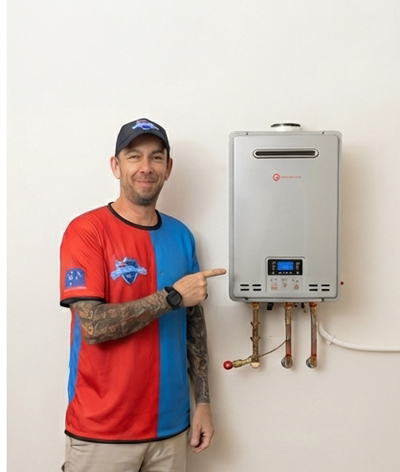 Plumber beside a gas continuous-flow hot water unit