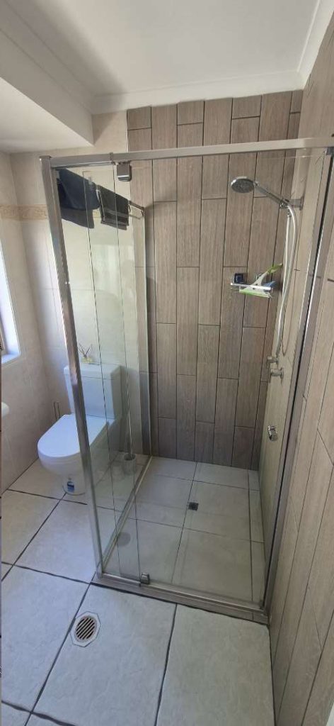 Tiled shower wall with a new mixer