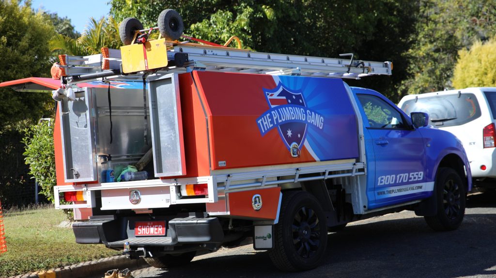Plumbing Gang truck at a job