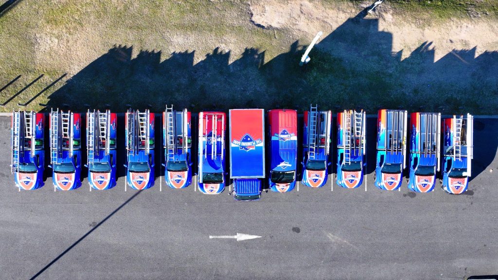 Aerial view of The Plumbing Gang fleet of utes
