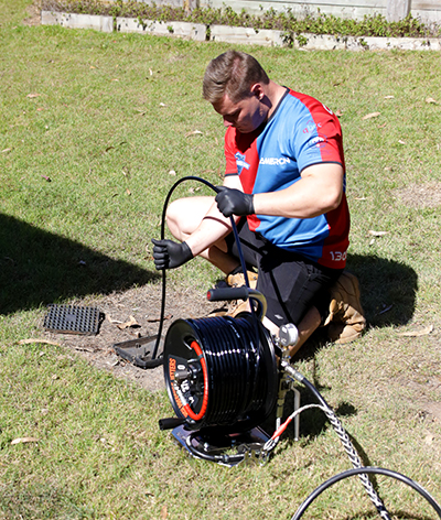Plumber with pipe relining equipment