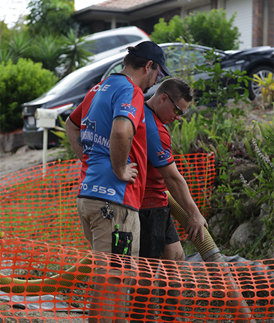 Plumbing Gang plumbers jet blasting a blocked drain