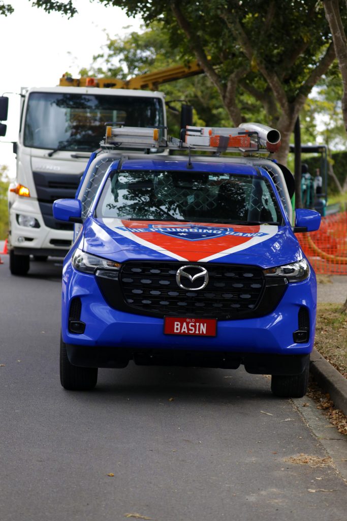 Plumbing Gang ute parked outside a job