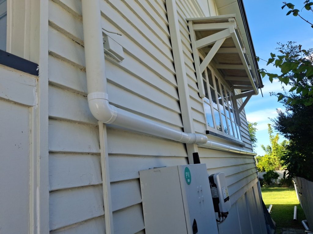 Downpipe and stormwater connection on a weatherboard home