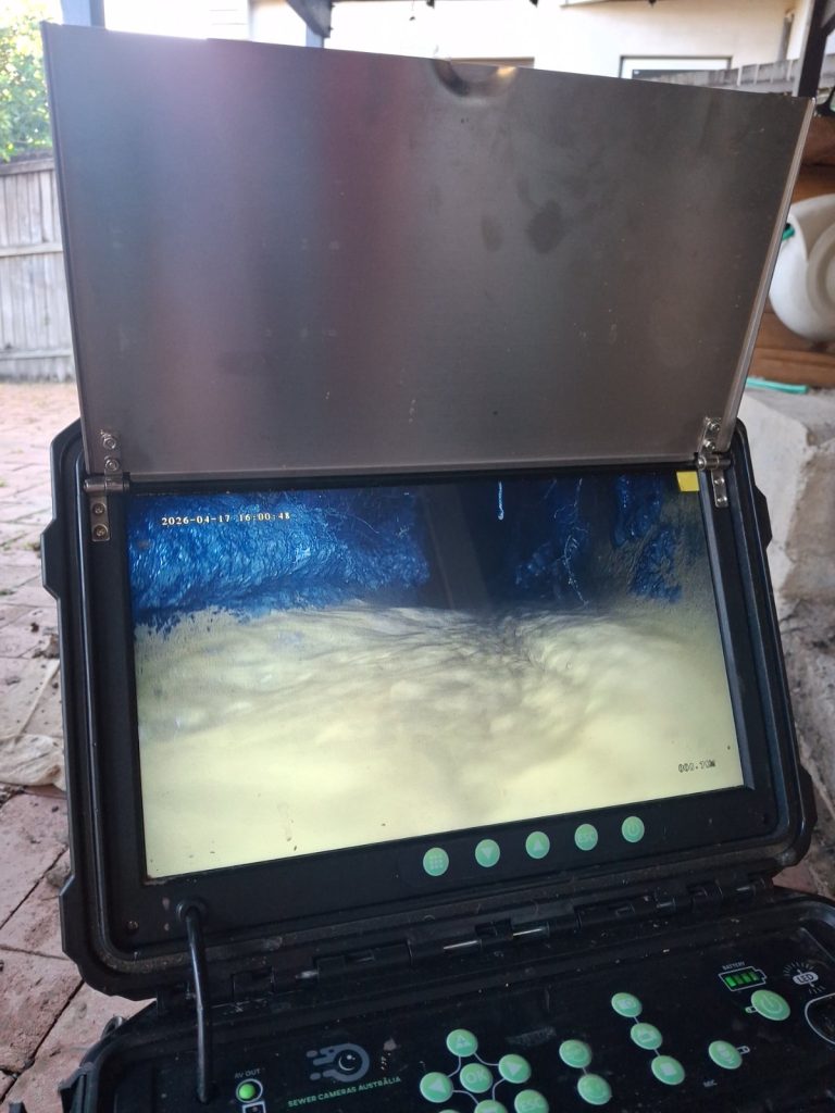 Camera view of a drain being flushed during jet blasting