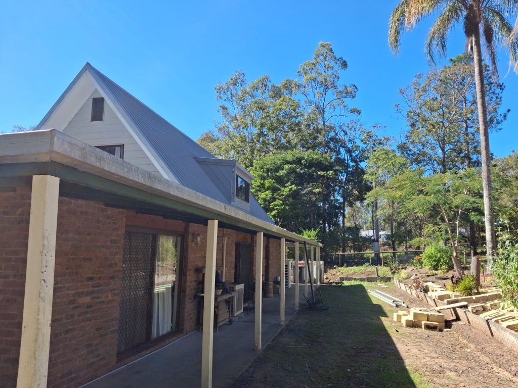 Brisbane home roofline with gutters and downpipes