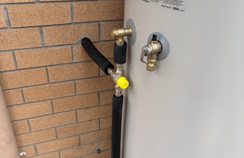 Hot water relief valve and tempering valve fitted by The Plumbing Gang