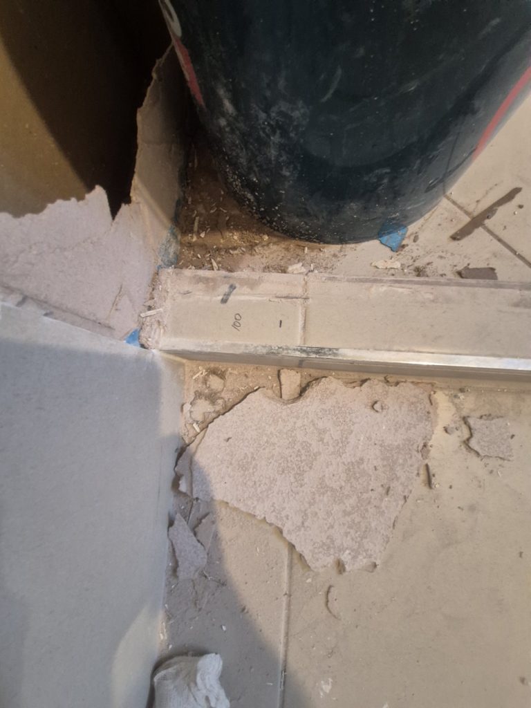 Shower base opened up to repair a leaking shower