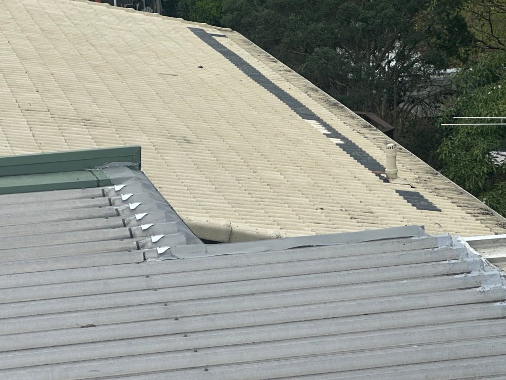 Metal roof inspected for leaks